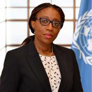 Photo of Vera Songwe with a UN flag in the background